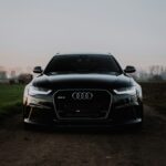 Black Rolls-Royce Cullinan SUV on a gravel country driveway